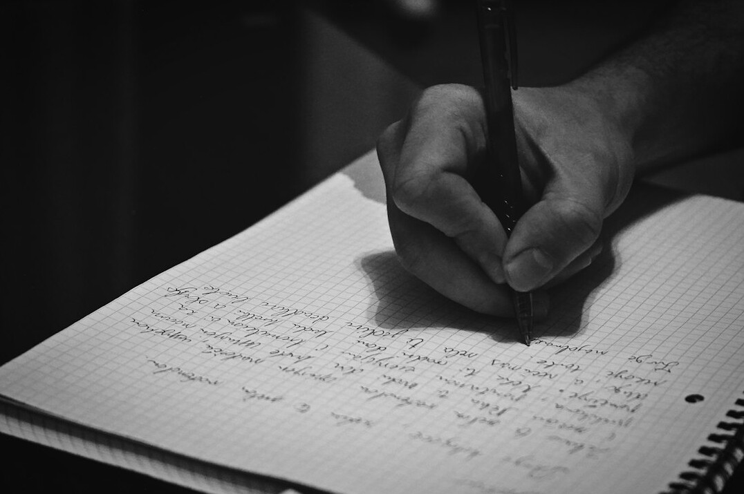 hand writing in notebook